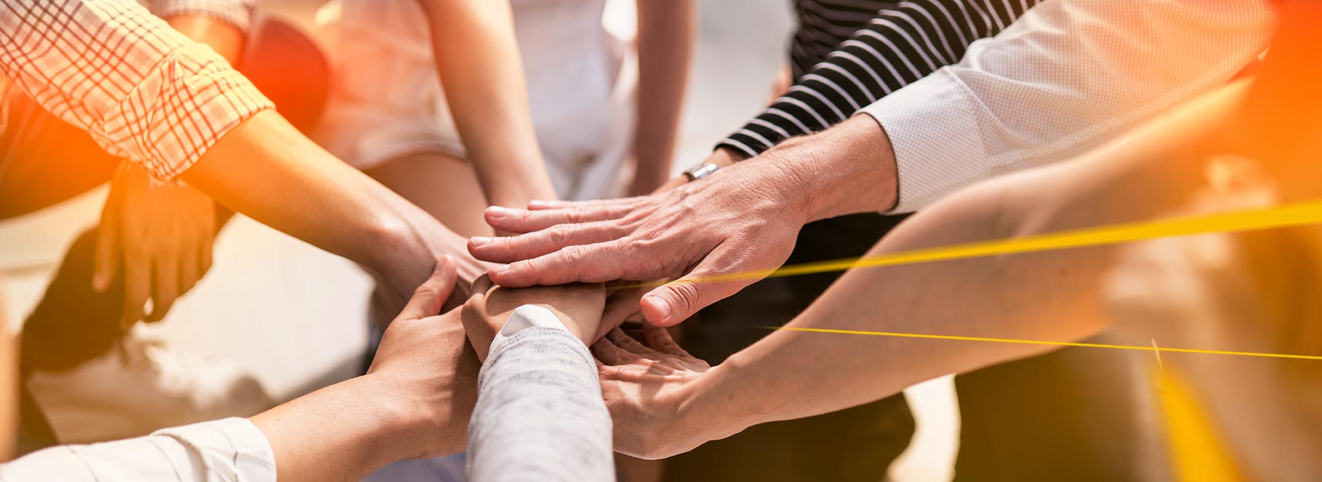 People put their hands together | LGI Social Care